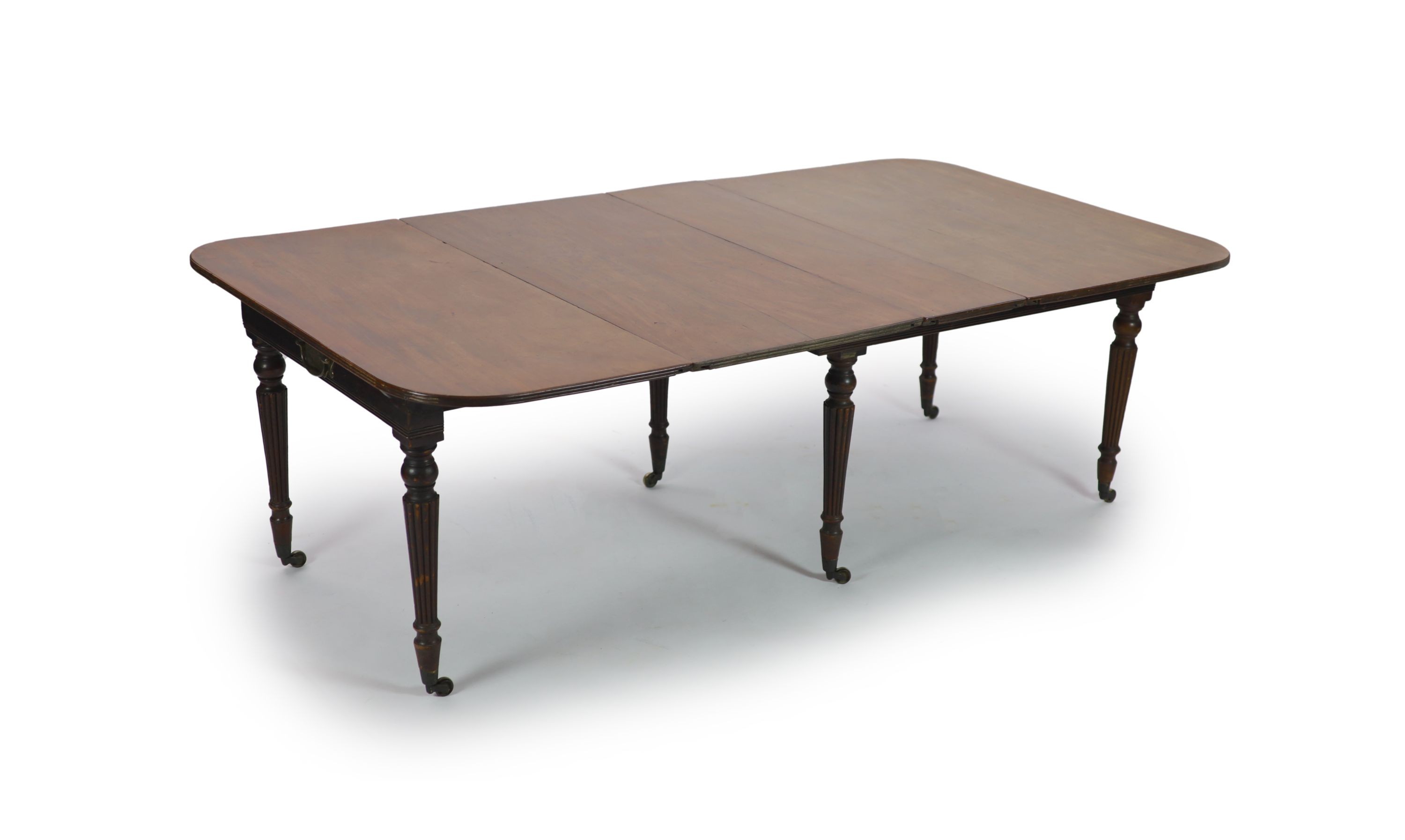 A Regency Morgan & Sanders Patent 'Imperial' mahogany extending dining table, W.137cm D.122cm Extends to 211cm H.72cm